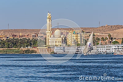 12.11.2018 Aswan, Egypt, A boat felucca sailing along a river of nilies on a sunny day Editorial Stock Photo