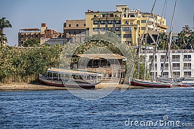 12.11.2018 Aswan, Egypt, A boat felucca sailing along a river of nilies on a sunny day Editorial Stock Photo