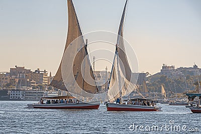 12.11.2018 Aswan, Egypt, A boat felucca sailing along a river of nilies on a sunny day Editorial Stock Photo