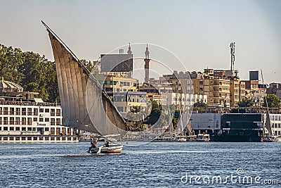 12.11.2018 Aswan, Egypt, A boat felucca sailing along a river of nilies on a sunny day Editorial Stock Photo