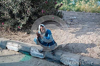 Aswan, Egypt, 24th of December 2018: Daily life on the riverside Nile in Egypt. Poor people living Editorial Stock Photo