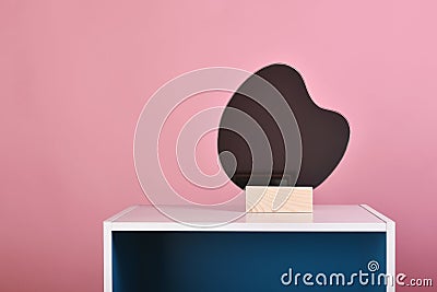 Asymmetric free form mirror, Water raindrop mirror reflect on pink pastel background Stock Photo