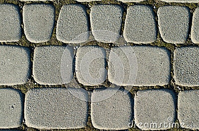 Asymmetric paving slabs of gray color, different size. Background Stock Photo