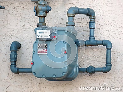 An ATCO urban natural gas meter measuring gas consumption, outside house gas meter Editorial Stock Photo