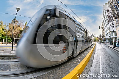 The Athens city tram train is approaching the central station at Syntagma square Editorial Stock Photo