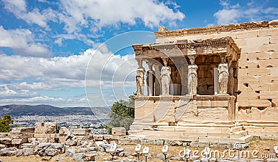 Athens, Greece. Erechtheion with Cariatides Porch on Acropolis hill, blue sky background Stock Photo