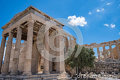 Athens, Greece. Erechtheion with Caryatid Porch on Acropolis hill, blue sky background Stock Photo