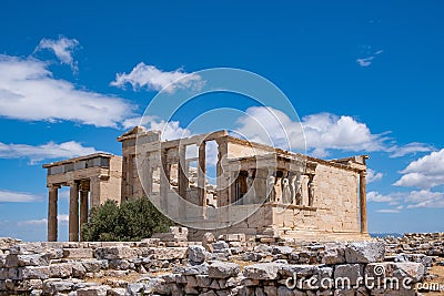 Athens, Greece. Erechtheion with Caryatid Porch on Acropolis hill, blue sky background Stock Photo