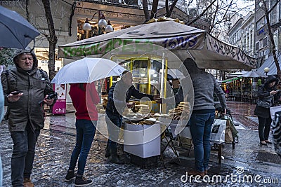 Street vendor of bread and puff pastry at night in Athens, Greece Editorial Stock Photo