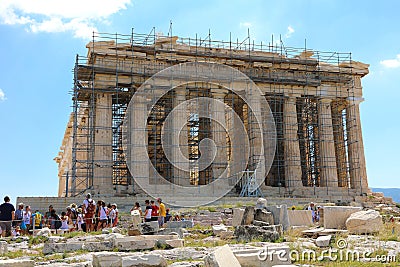 ATHENS, GREECE - JULY 18, 2018: Parthenon temple under renovation with tourists visiting the Acropolis in Athens, Greece Editorial Stock Photo