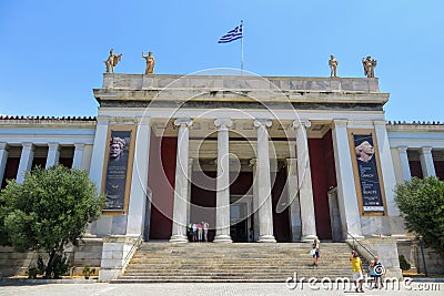 Looking outside at the front of the world famous National Archaeological Museum in Athens, Greece. Several visitors are walking t Editorial Stock Photo