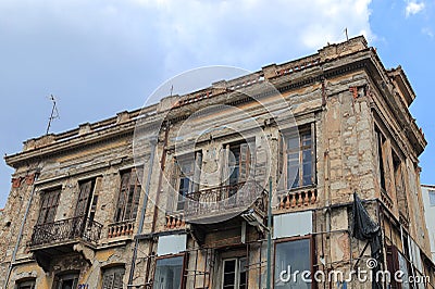 ATHENS, GREECE - June 13, 2016: Old and dilapidated building undergoing renovation in downtown Athens, Greece Editorial Stock Photo