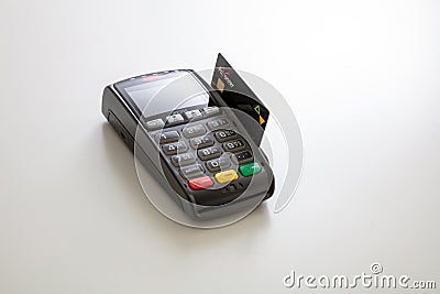 Payment machine Ingenico with credit card Payoneer isolated on white background Editorial Stock Photo