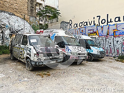 ATHENS, GREECE - MAY 15, 2022: Abandoned minibuses are painted with graffiti on Agiou Konstantinou street Editorial Stock Photo