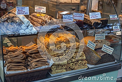 Traditional Greek snacks and pastry products on a shop window in Athens, Greece Editorial Stock Photo
