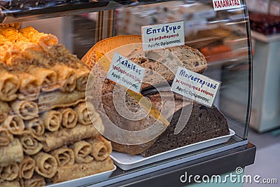 Traditional Greek snacks and pastry products on a shop window in Athens, Greece Editorial Stock Photo