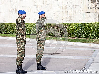 Greek solider saluting the Greek presidential guard, in front of the Greek parliament on Syntagma square. Editorial Stock Photo