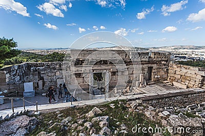 Tourists near the Acropolis Propylaea with Athens panorama background Editorial Stock Photo