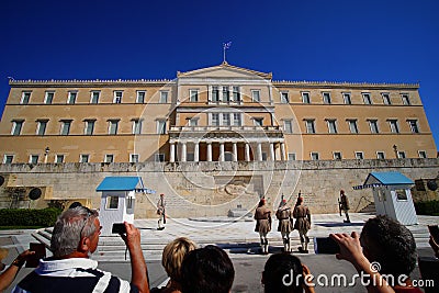 Athens, Greece - October 06, 2014 Tourists photographing the changing of the guard in front of the greek parliament building in Editorial Stock Photo