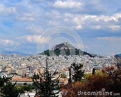 Athens Greece, Lycabettus hill under cloudy sky Stock Photo