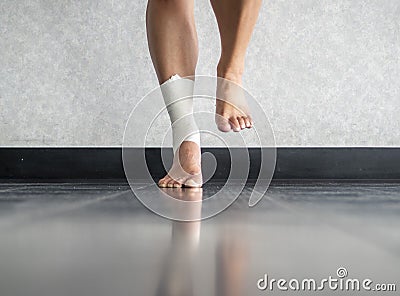 Athlete balancing to regain proprioception on sprained ankle Stock Photo