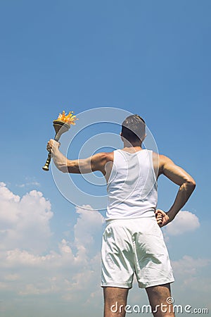 Athlete Holding Sport Torch Blue Sky Stock Photo