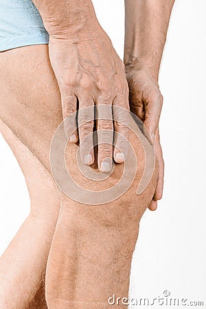 Athlete man feeling pain to the knee and to the quadriceps Stock Photo