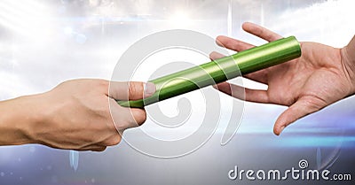 Athlete passing baton against digitally generated background Stock Photo