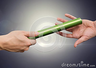 Athlete passing the baton to teammate Stock Photo