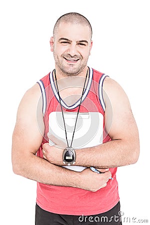 Athlete posing with sport timer and clipboard Stock Photo