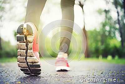 Athlete runner feet running on the road closeup on shoe. Jogger Stock Photo