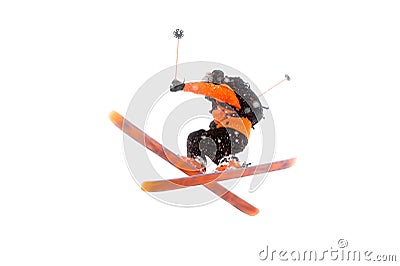 The athlete skier in the orange black suit does the jump trick by crossing the skis. real photo made in the mountains Stock Photo