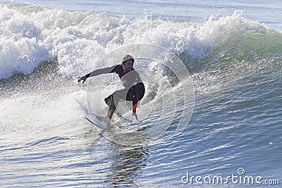 Athlete surfing on Santa Cruz beach in California Editorial Stock Photo