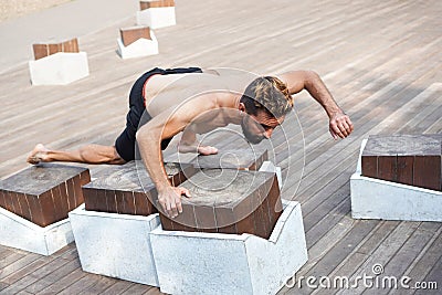 Athlete yogi man doing balance training in the city park Stock Photo