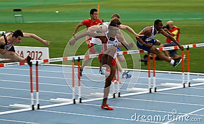 Athletes compete in the 110 meters final Editorial Stock Photo