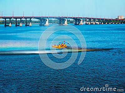 Athletes in kayaks in training near the river fountain in a rainbow of splashes Editorial Stock Photo