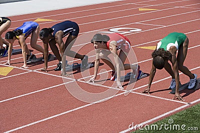 Athletes At Start Of Running Track Stock Photo