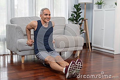 Athletic and active senior man using furniture for pushup. Clout Stock Photo