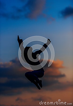 Athletic dancer in a super jumping pose Stock Photo