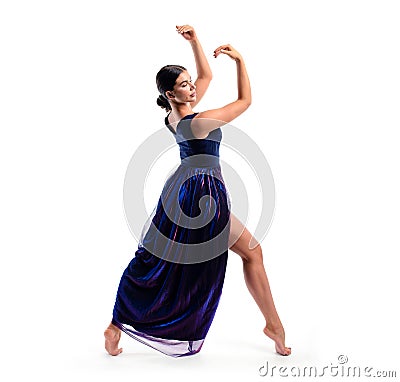 Athletic girl in a dress performs a pose of rhythmic gymnastics Stock Photo