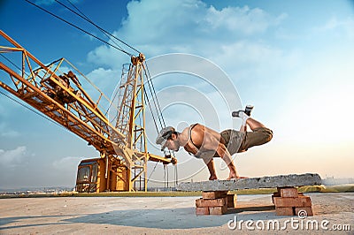 Athletic man doing exercise push ups on hands. Stock Photo