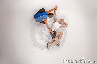 athletic man streching with personal trainer Stock Photo