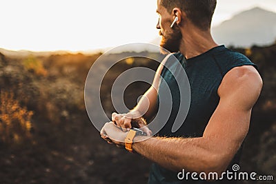 Athletic runner start training on fitness tracker Stock Photo