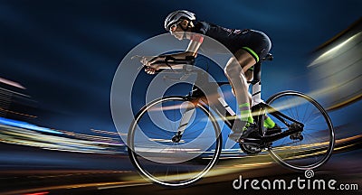 Athletic woman cycling road bike in the evening. Stock Photo