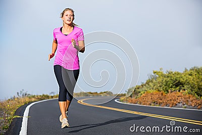 Athletic woman running jogging outside Stock Photo