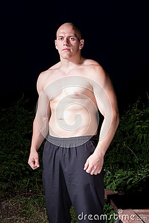 Athletic young man outdoors at night Stock Photo