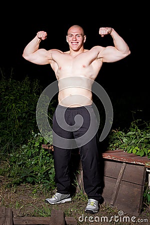 Athletic young man outdoors at night Stock Photo