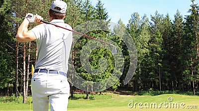 Athletic young man playing golf in golfclub Stock Photo