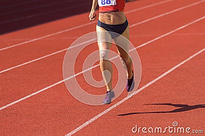 Athletics woman running on the track field Stock Photo