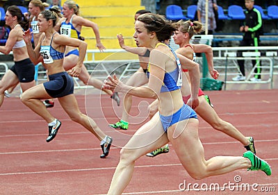 Athlets compete in 100 meters race Editorial Stock Photo